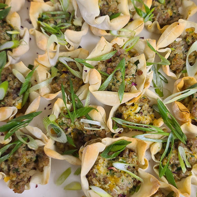 Sausage stars catering tray — crisp baked wonton cups filled with local pork sausage and cheese, topped with house-made ranch — Radical Gardens, Timmins