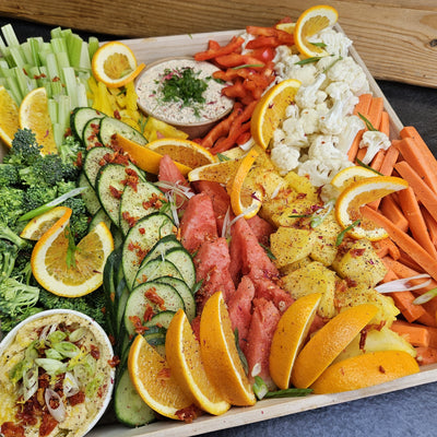 A catering box of fresh seasonal vegetables and fruit from Radical Gardens' farm and local growers, with house-made hummus, a second dip, fresh herbs and edible flowers — Timmins