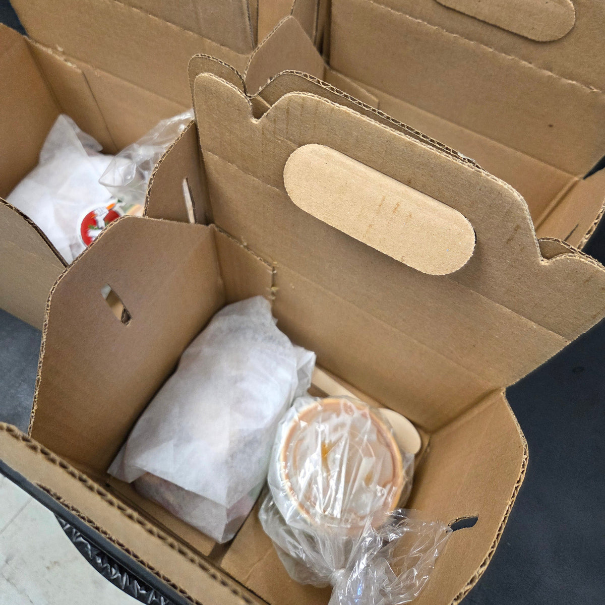 Individually boxed soup and sandwich lunches — a large artisan sandwich on sourdough or ciabatta alongside an 8oz house-made soup — Radical Gardens catering, Timmins
