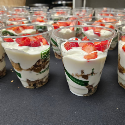Individually portioned catering yogurt parfaits layered with house-made granola and seasonal berries in serving cups — Radical Gardens, Timmins